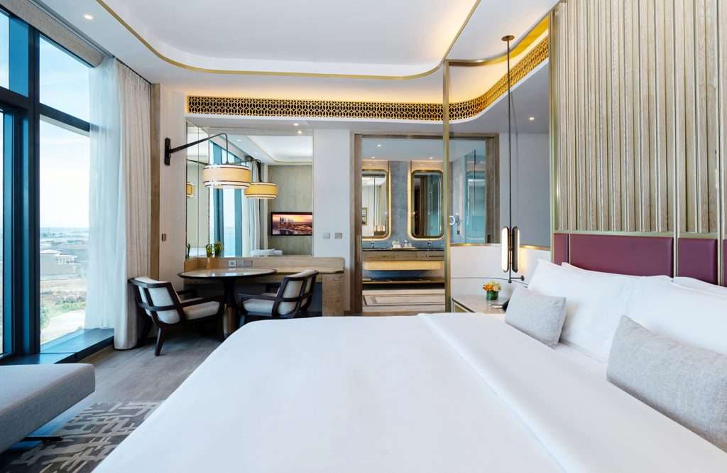 White bed and gray pillow hotel room